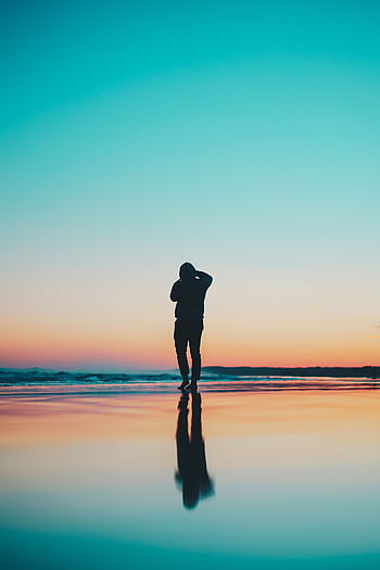 Silhouette Of Person Walking On Beach During Sunset Human Alone Man