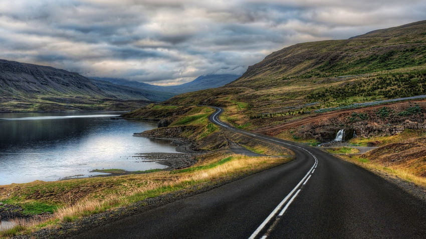 blacktop road winding around a lake r, hills, valley, road, r, lake, blacktop HD wallpaper