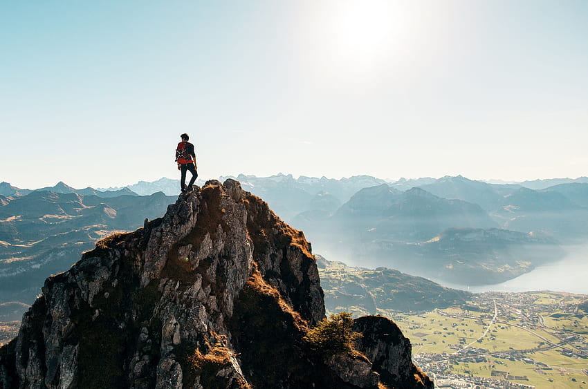 Hiker on top of a mountain U HD wallpaper