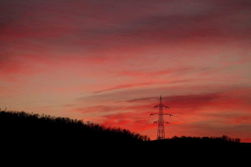/ a transmission tower among trees under a red sky at dusk, transmission tower at dusk HD wallpaper