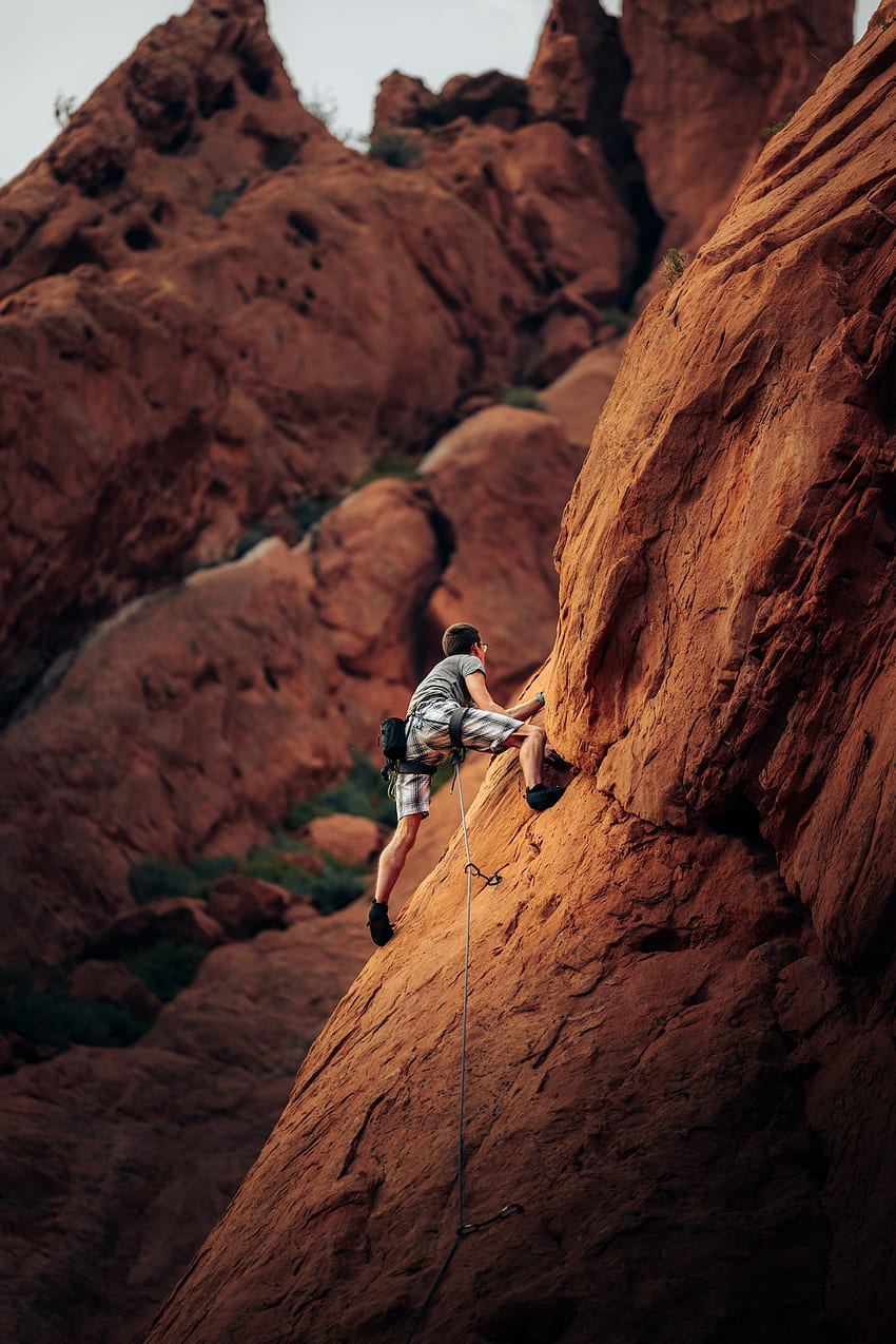 Man Rock Climbing on Mountain Side · Stock HD phone wallpaper