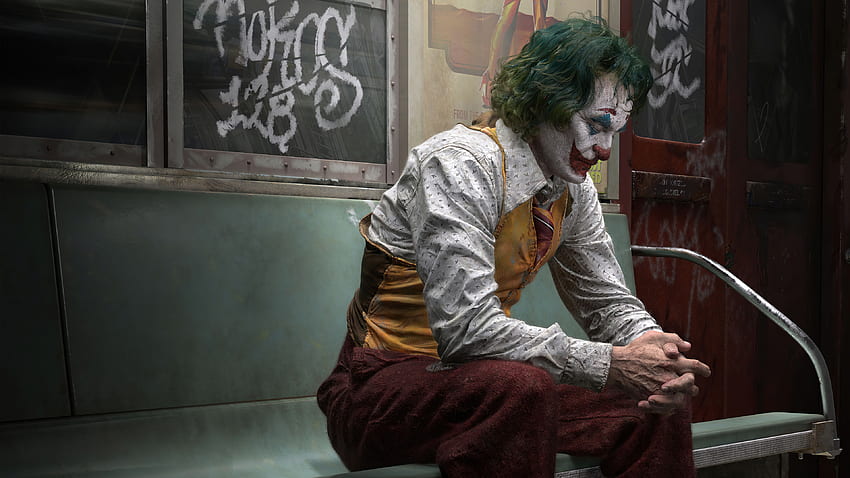 Trauriges Joker-Gesicht, das auf Bank-Superhelden sitzt HD-Hintergrundbild