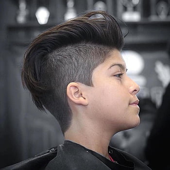 Premium Photo  Teenage boy haircuts hairdresser in the barber shop  fashionable stylish retro hairstyle