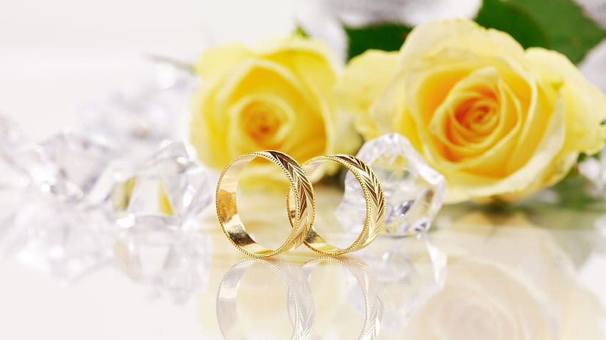 Gold Wedding Rings Forming A Heart Shape Over Pale Background Stock Photo -  Download Image Now - iStock