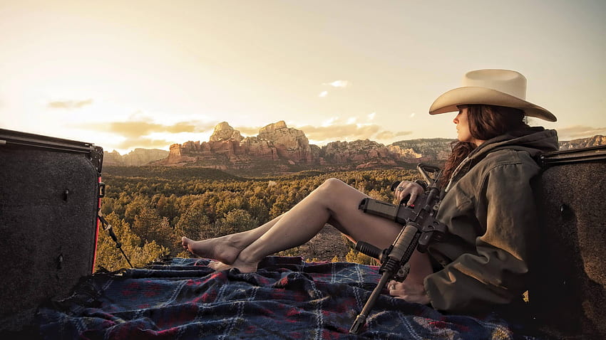 Cowgirl with a big gun in the back of a truck. Writing Inspiration HD wallpaper