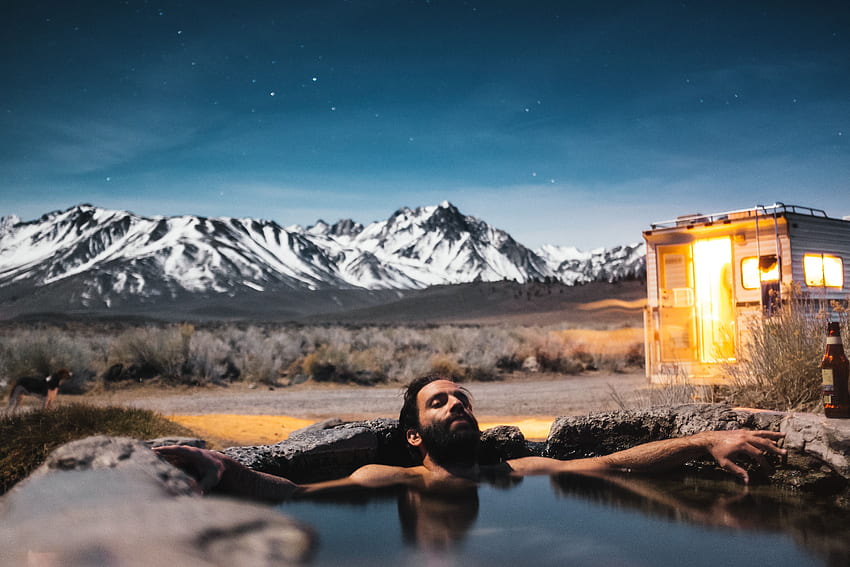 men in hot spring and ice covered mountains HD wallpaper