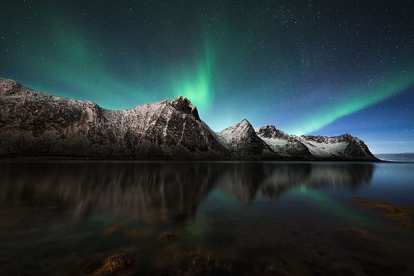 The northern lights over a placid fjord in Senja, Norway. Iceland , Northern lights, Northern lights trips HD wallpaper
