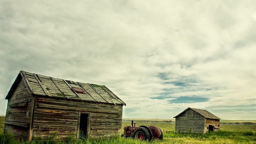 tractor parked between old shacks, clouds, shacks, farm, tractor HD wallpaper