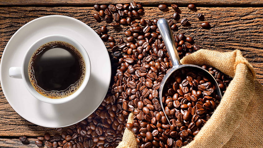 Cup Of Coffee And Roasted Beans On Wood Table U HD wallpaper