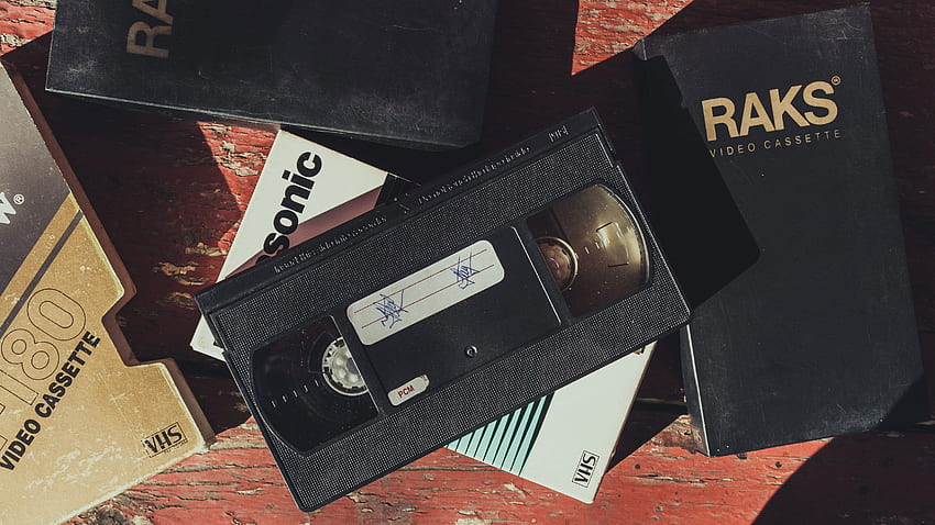 Schwarzes VHS-Band, Text, Kommunikation, westliche Schrift, Technologie. VHS-Kassette, Technologie, VHS HD-Hintergrundbild