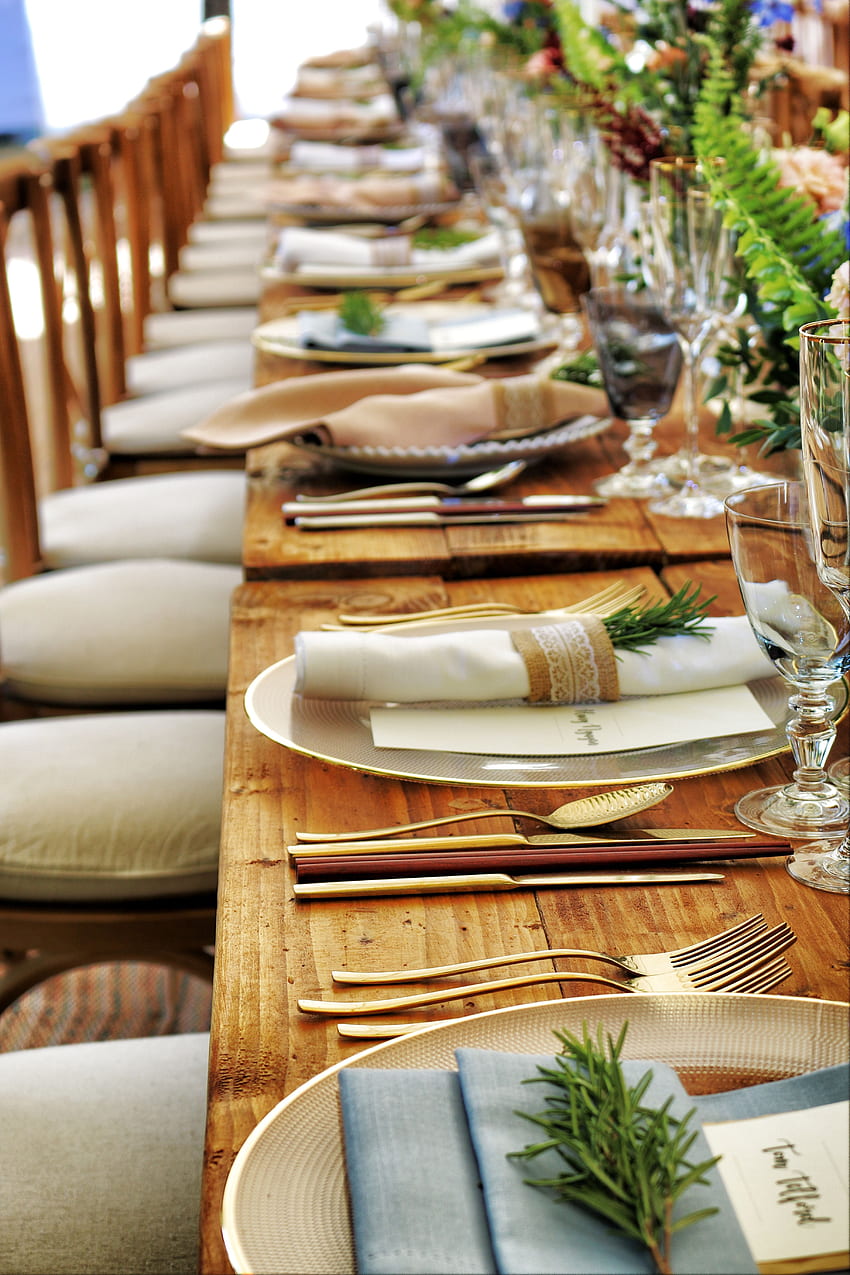 Close Up Of Dinnerware Set On Top Of Table With Glass Cups · Stock