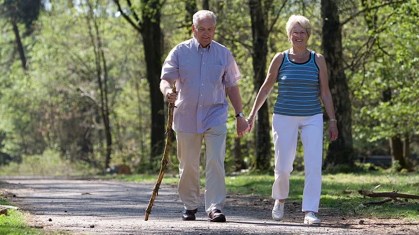 Older couple walking outdoors today . HD wallpaper