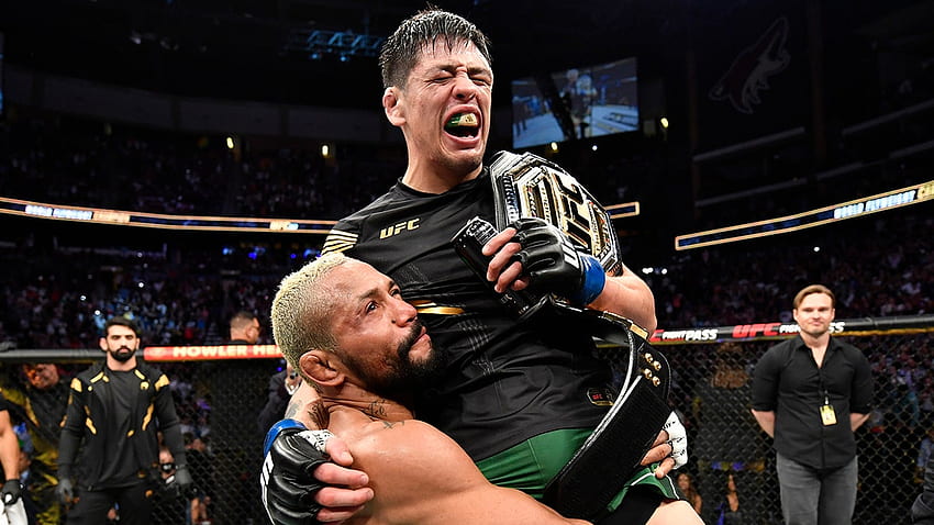 UFC's Brandon Moreno celebrates with opponent Deiveson Figueiredo after ...