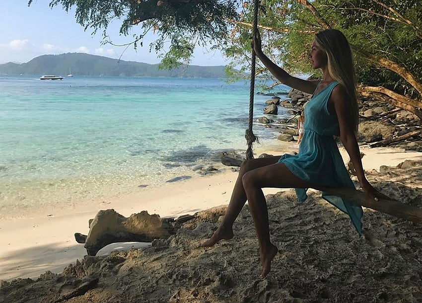 Anjelica Ebbie in a Far Away Place, sand, blonde, seashore, bare feet, sitting on pole swing, trees, blue sheer dress, beach HD wallpaper