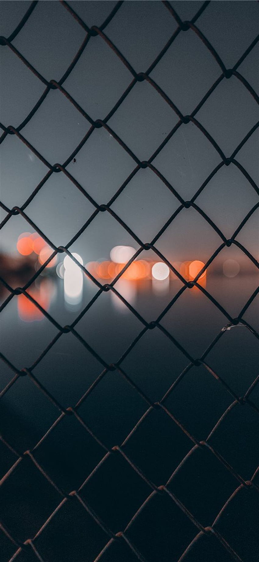 chain link fence behind bokeh iPhone X HD phone wallpaper