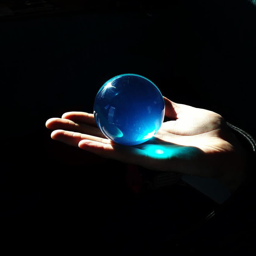 person holding blue ball with light – Chelsea piers on Unsplash HD phone wallpaper
