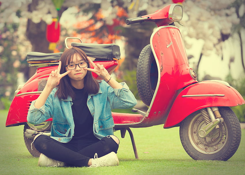 Girl Doing Peace Sign Indian Sitting in Front of Red Scooter HD wallpaper