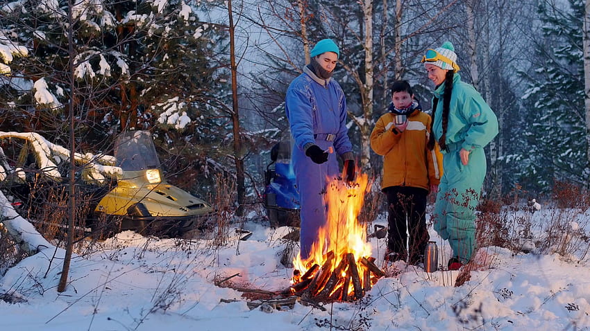 Winter forest. Camping. Family standing in the woods by the fire. Making a selfie Stock Video Footage, Winter Campfire HD wallpaper