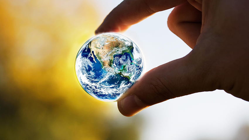 A small earth globe - The world in our hands HD wallpaper