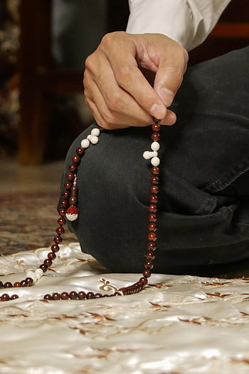 Image of Muslim Tasbih Prayer Beads Palm Seeds Islamic Prayer Zikr Misbaha  or Tasbih and Attar Perfume Scent Bottle on Glitter Background Beautiful  Scenario Image-XI924819-Picxy