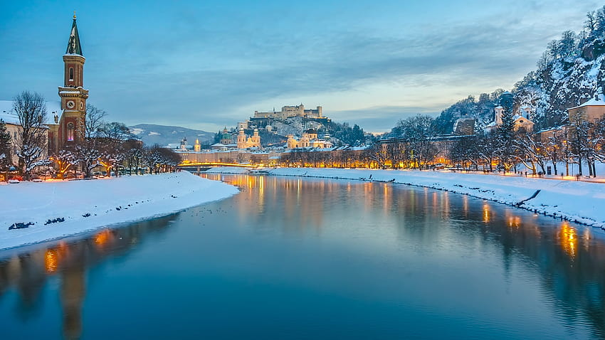 Historic city of Salzburg with Salzach river in winter during blue hour, Salzburger Land, Austria. Windows 10 Spotlight HD wallpaper