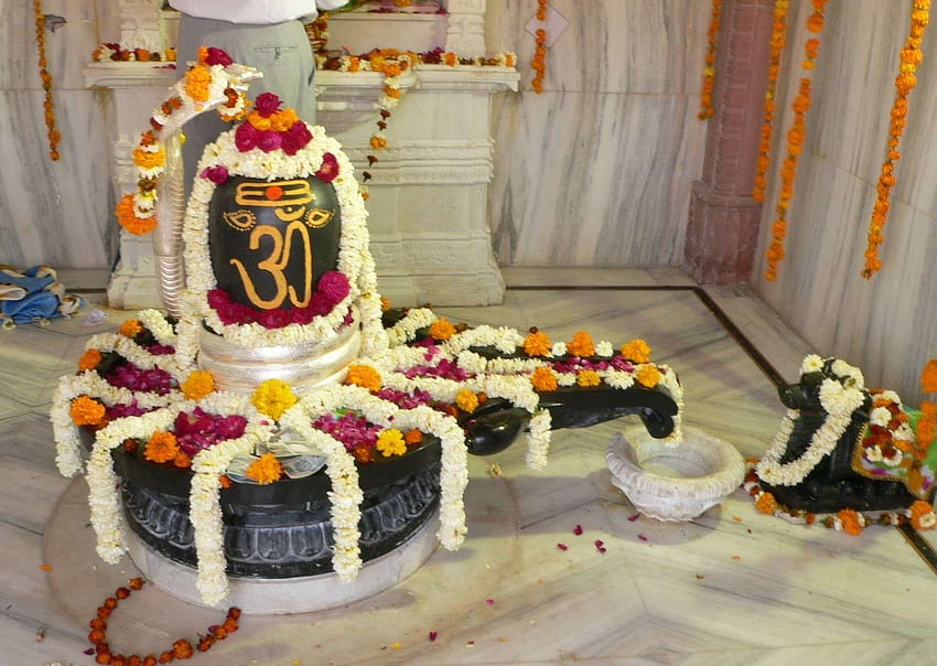 Premium Photo | Shiva linga decorated with flowers & bel patra or leaf and  haldi kumkum for pooja or worshipping of lord shiva or shankar bhagwan
