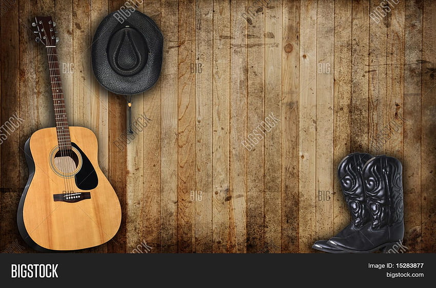 Sombrero de vaquero, botas y guitarra contra un granero viejo, botas campestres, country western fondo de pantalla