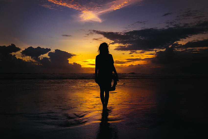 Silhouette of woman walking on a beach at sunrise, sand, coast, girl, gold, sunrise, woman, beach, waves, clouds, hour, sky, sun, water, ocean, golde HD wallpaper