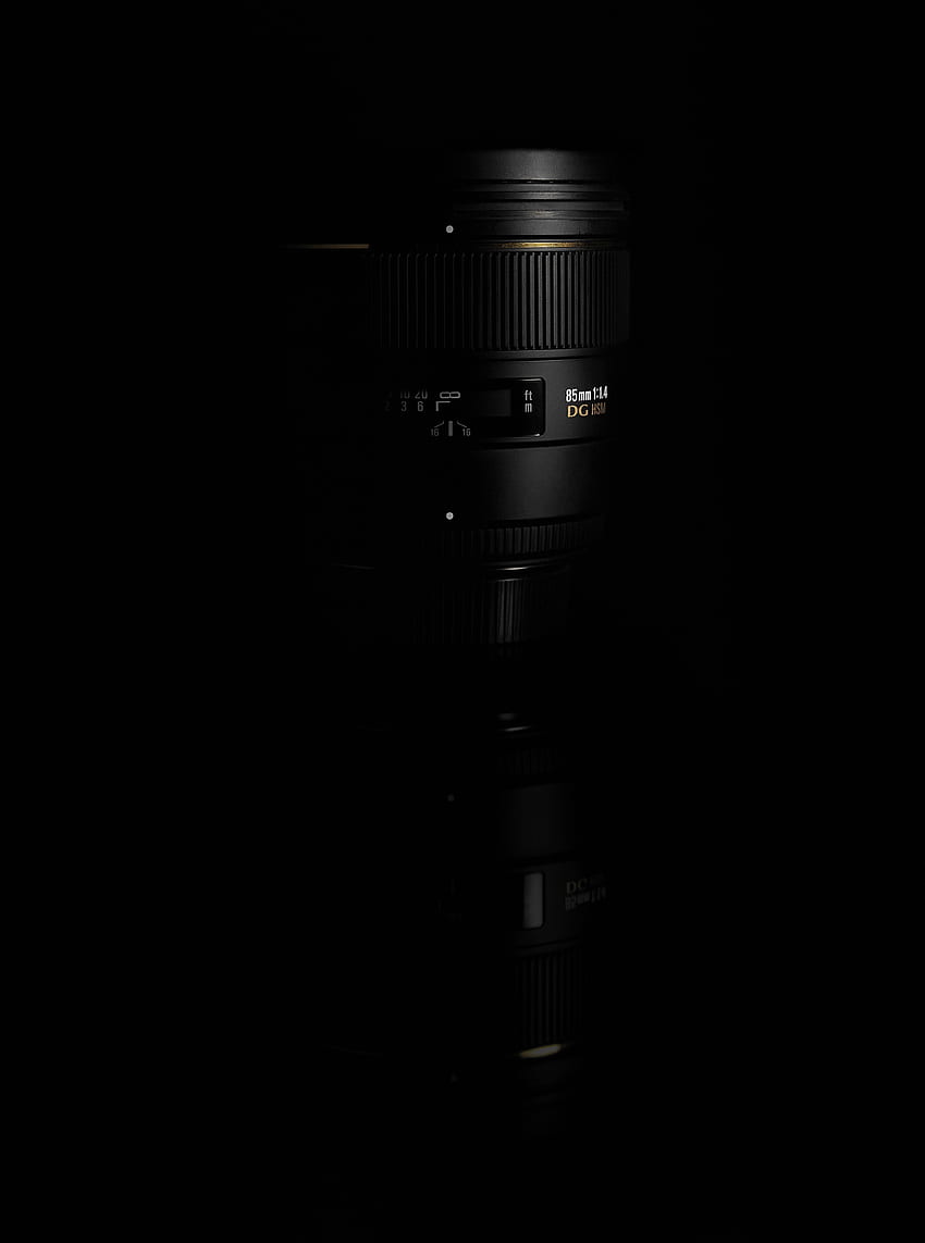 black 85mm dslr camera lens on a black reflective surface85mm dslr HD phone wallpaper
