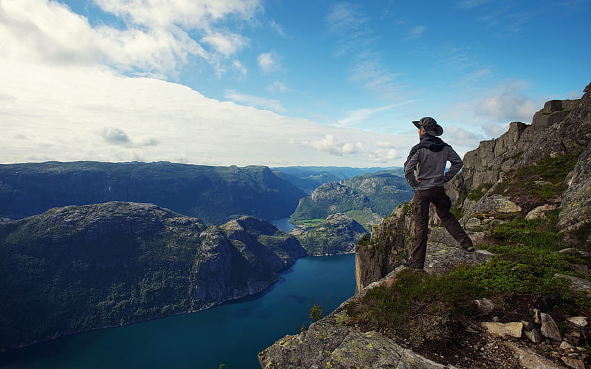 Guy Man traveler hiker fjord panorama sea lonely sky mountain clouds HD wallpaper