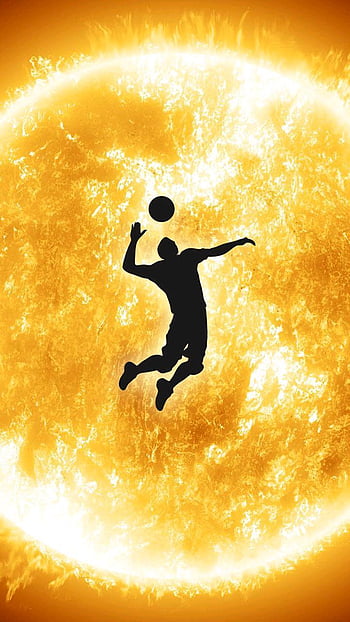 Volleyball player jumping on a black background