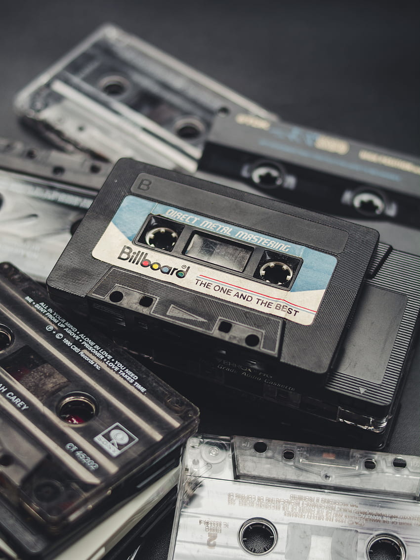 Premium Photo | Two old cassette tape on a wooden background