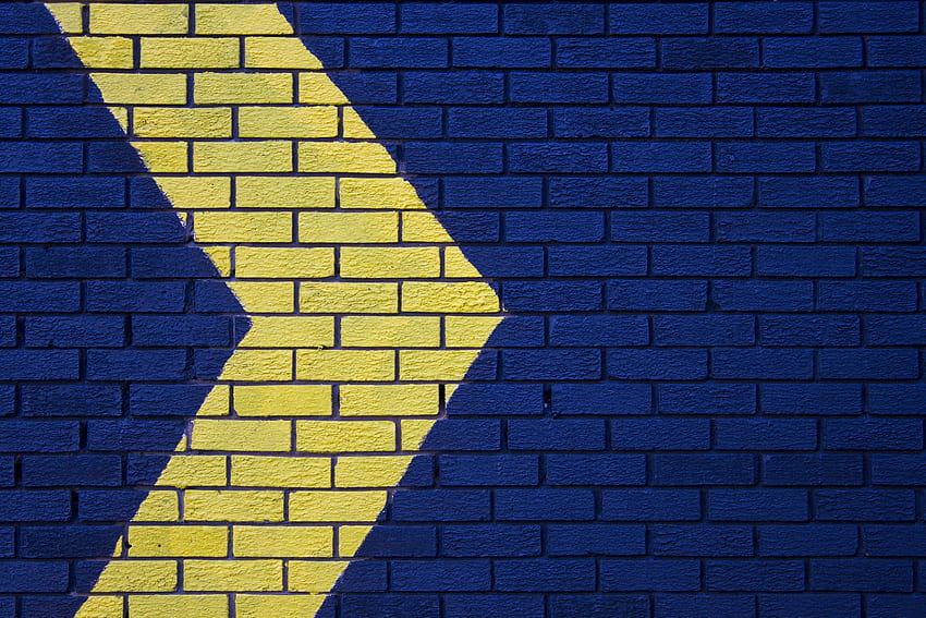 wall, brick, arrow, blue, yellow HD wallpaper