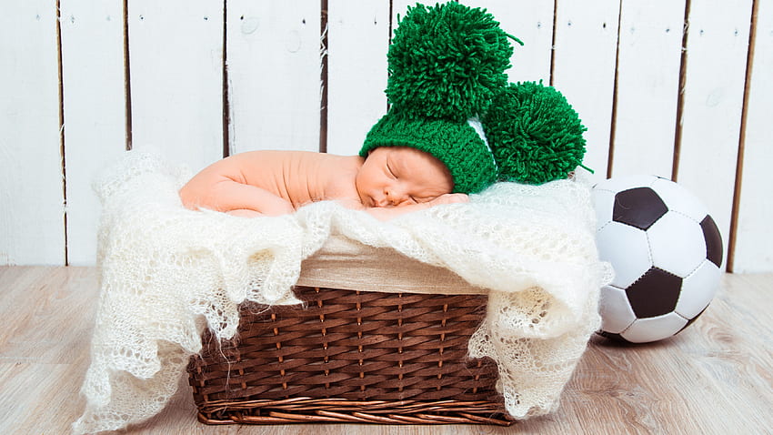 Cute Newborn Baby Is Sleeping Inside Bamboo Basket Wearing Green Woolen Knitted Cap In White Background Cute HD wallpaper