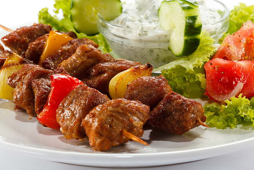 Kebab with vegetable salad and white dip on white ceramic plate HD wallpaper