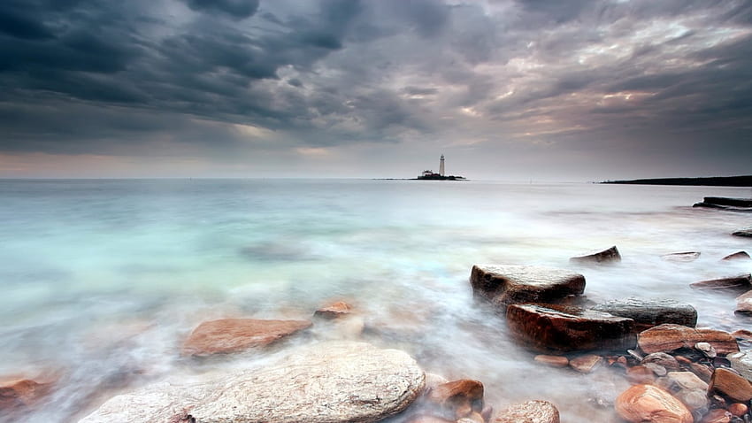 lighthouse on an island in a misty sea, sea, island, shore, lighthouse, clouds, rocks HD wallpaper