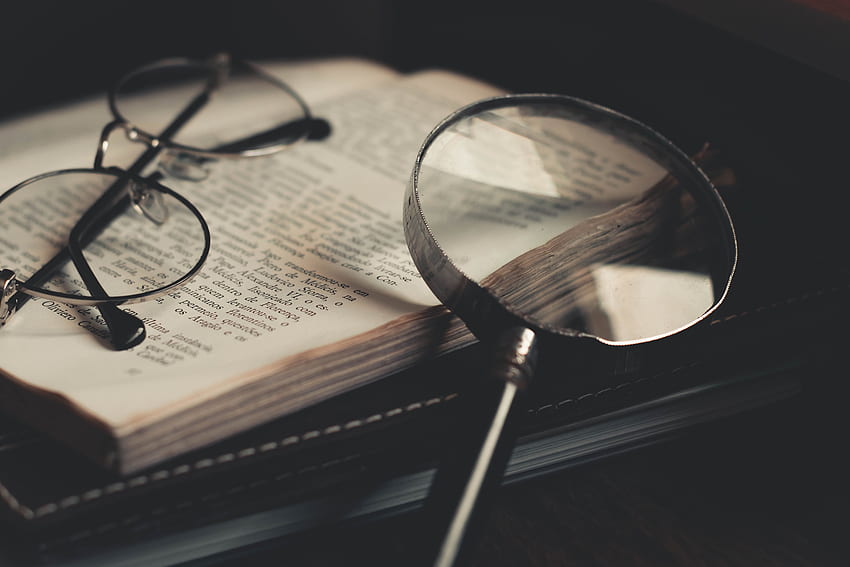 Gray Magnifying Glass and Eyeglasses on Top of Open Book · HD wallpaper