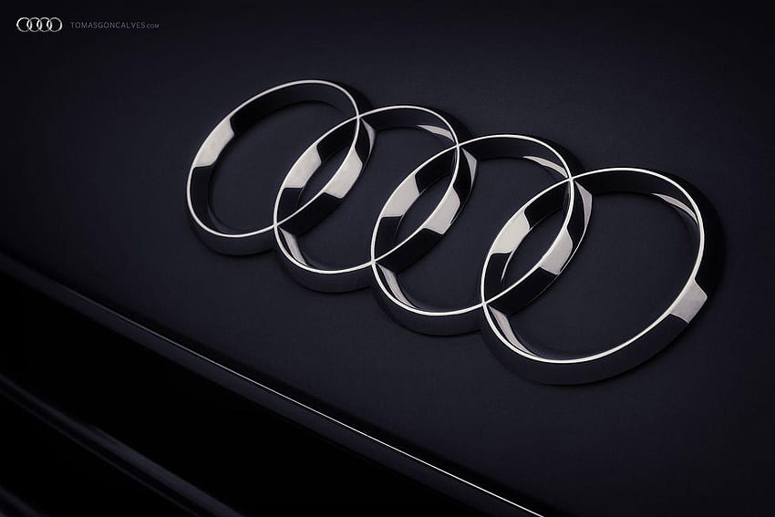 Symbol samochodu Audi / Symbol Audi to cztery pierścienie sufitowe, które odzwierciedlają czterech producentów zrzeszonych w branży motoryzacyjnej Tapeta HD