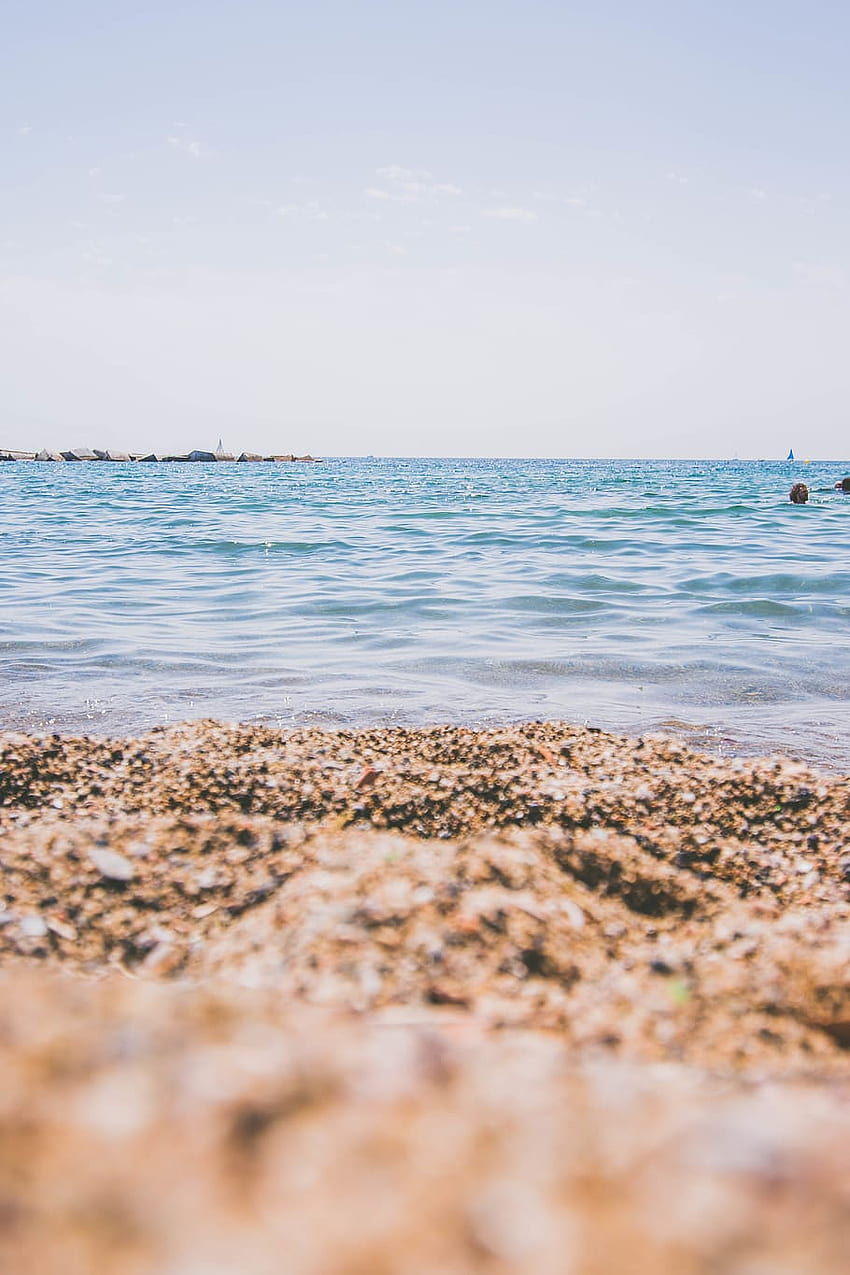 : 昼間、スペイン、スペイン ビーチの間に海岸近くで泳いでいる人々 HD電話の壁紙