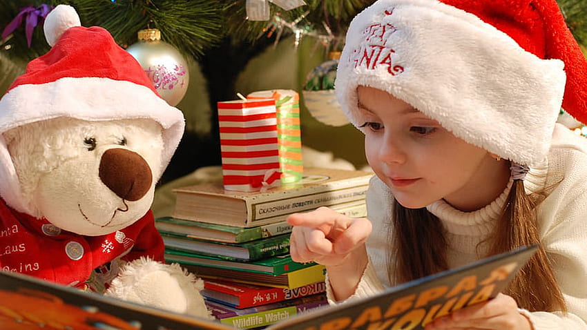 Cute Little Girl With Santa Claus Cap Is Reading Book Cute HD wallpaper