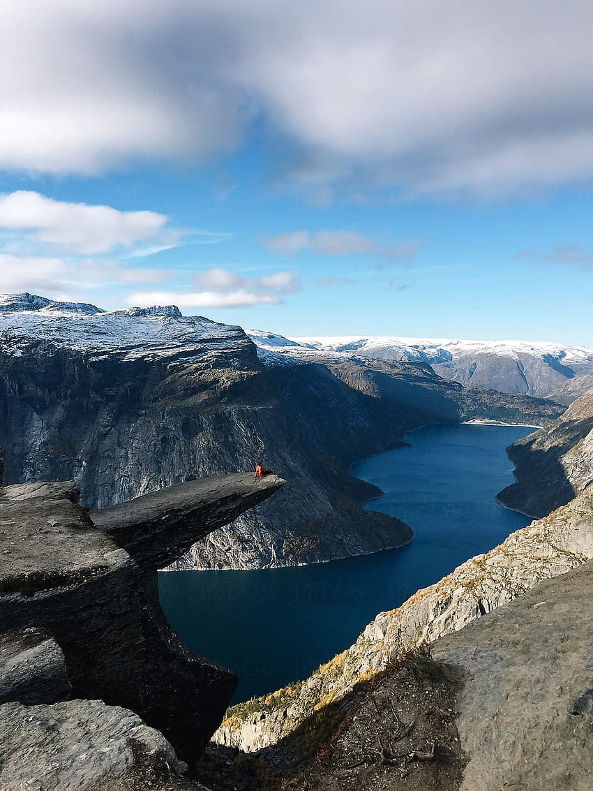 Hiker Sitting To The Edge Of Trolltunga Rock, Norway By Sky Blue Creative HD phone wallpaper