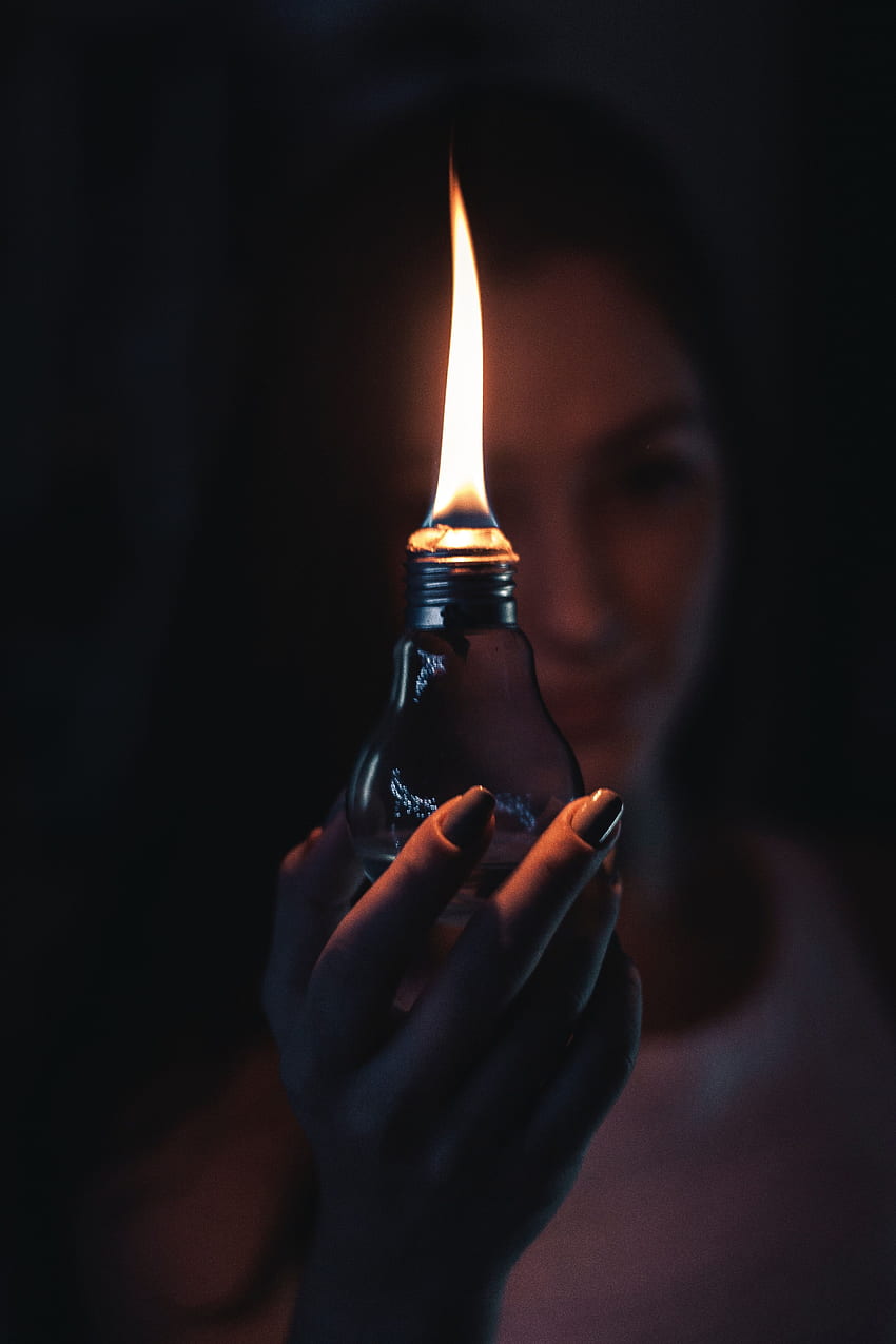 Woman Holding Lighted Oil Lamp · Stock HD phone wallpaper
