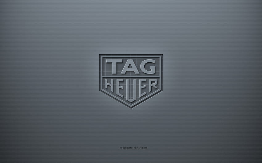 โลโก้ TAG Heuer พื้นหลังสร้างสรรค์สีเทา สัญลักษณ์ TAG Heuer เนื้อกระดาษสีเทา TAG Heuer พื้นหลังสีเทา โลโก้ TAG Heuer 3d วอลล์เปเปอร์ HD