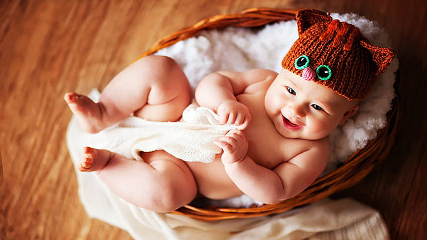 Smiling Cute Child Baby Is Lying Down Inside Basket Wearing Brown Woolen Knitted Cap Cute HD wallpaper