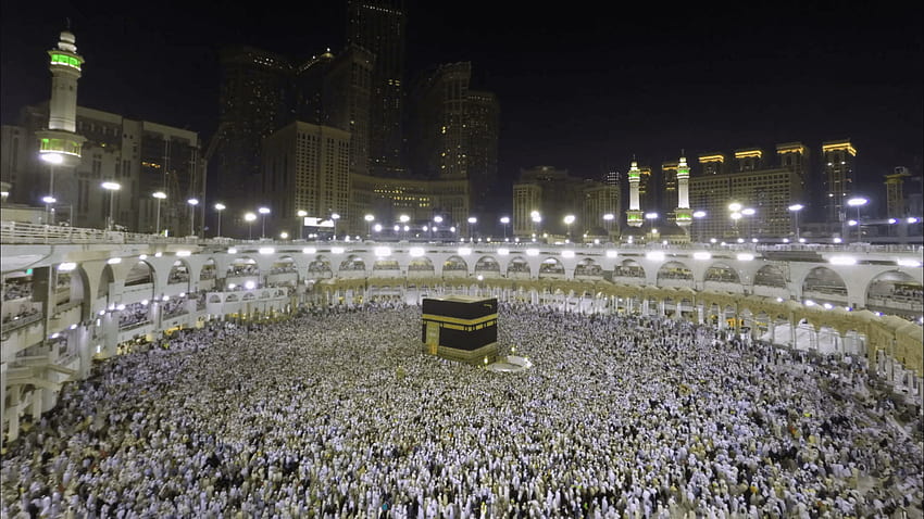 Vídeo de lapso de tempo de peregrinos muçulmanos circulando em torno da sagrada Caaba, noite na Arábia Saudita papel de parede HD