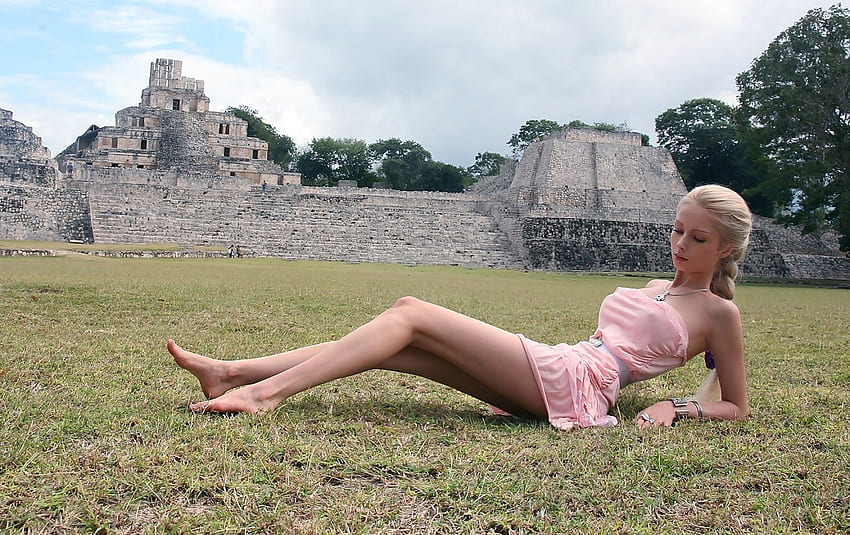 Valeria Lukyanova Barbie Doll look, strapless mini dress, blonde, bare feet, hot, grassy area, jewelry, Mayan ruins, trees, blue belt, pale pink HD wallpaper