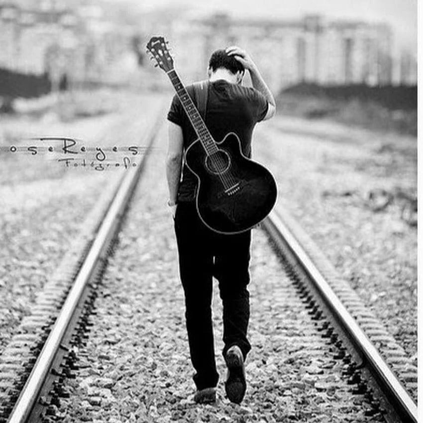 Trauriger Junge mit Gitarre HD-Handy-Hintergrundbild