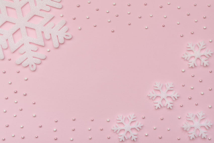 Christmas pink background with white snowflakes and beads. Conceptual HD wallpaper