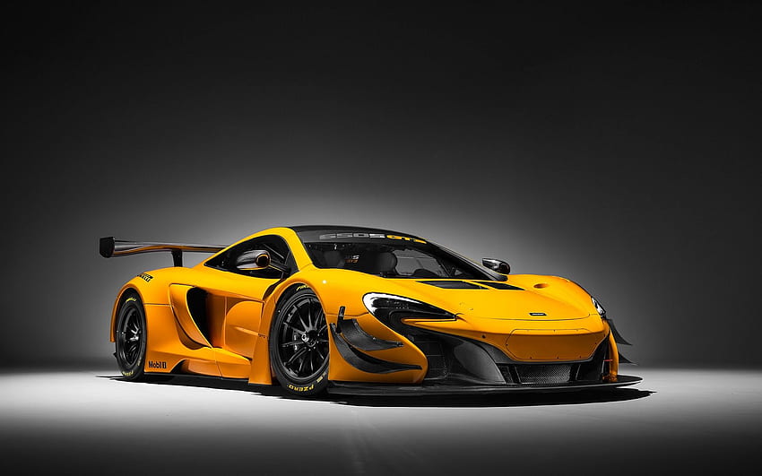 McLaren piękny żółty samochód sportowy. Skały Tapeta HD