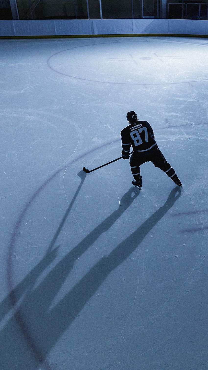 Hockey Player Hitting The Puck In A Dark Snowy Atmosphere Background, Cool  Hockey Pictures Background Image And Wallpaper for Free Download